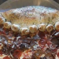 Calzone Garlic Knot Pie · Large pie, half calzone half pizza lined with garlic knots