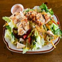 Southwest Chicken Salad · Grilled chicken served on a fresh salad blend, complete with tomatoes, peppers, onions and s...