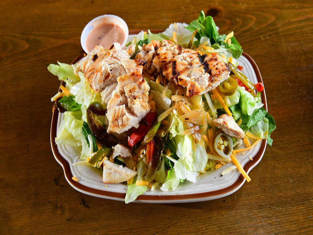 Southwest Chicken Salad · Grilled chicken served on a fresh salad blend, complete with tomatoes, peppers, onions and shredded cheddar Jack cheese, all topped with jalapeños. Comes with a side of our kickin ranch dressing.