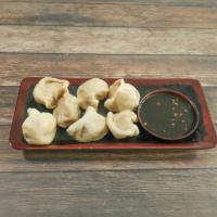 20. Steamed Pork Dumpling · 8 pieces.