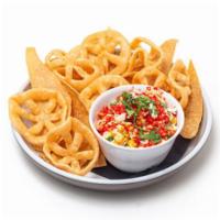 Flamin Hot Cheetos Elote · Warm grilled corn with a light and creamy mayonnaise-based dressing, queso fresco, cilantro ...