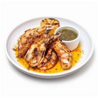 Shrimp on The Halfshell · Six jumbo blue shrimp on the half shell. Grilled in chile-garlic butter. Served with fresh c...