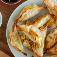 A5.	Golden Potsticker · (7) potstickers filled with a pork & veggie mix, then fried.
Comes with a side of soy sauce.