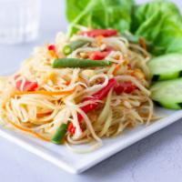 Papaya Salad · A Thai salad of shredded green papaya and tomatoes seasoned with fish sauce and fresh lime. ...