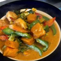 Pumpkin Curry · Fresh pumpkin chunks and yellow curry cooked in coconut milk, Thai basil leaves, bell pepper...