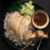 59A.) Khao Mun Gai · Thai style of Hainanese chicken rice dish; boiled chicken breast over coconut rice with a gi...