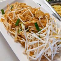 Pad Thai · Rice noodles stir-fried in our savory house sauce with onions, ground peanuts, eggs, and you...