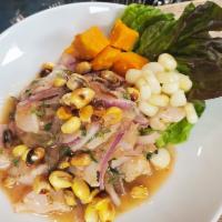 Fish Ceviche with Rocoto and Leche de Tigre · Glazed sweet potatoes, corn, onions and cancha. Gluten free and dairy free.