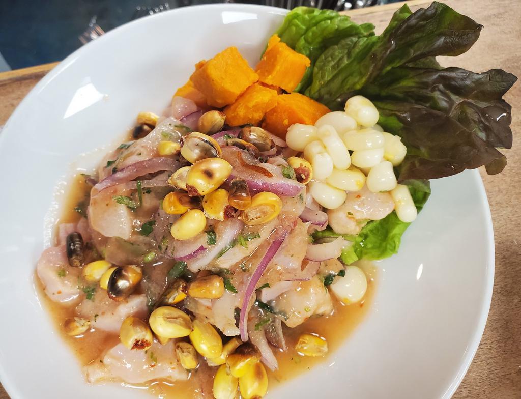 Fish Ceviche with Rocoto and Leche de Tigre · Glazed sweet potatoes, corn, onions and cancha. Gluten free and dairy free.