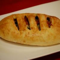 Create Your Own Calzone · Choose 3 fillings, sauce and mozzarella cheese.
