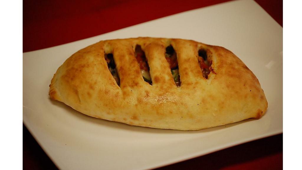 Create Your Own Calzone · Choose 3 fillings, sauce and mozzarella cheese.