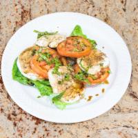 Caprese Salad · Fresh mozzarella, fresh tomatoes, olive oil and balsamic vinegar.