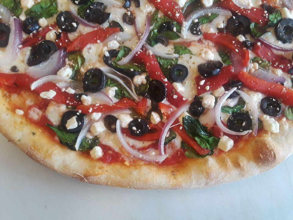 Mediterranean Pizza · Spinach, feta cheese, black olives, red onions, roasted red peppers and oregano.