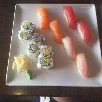 D03. Tricolor Sushi · 1 tuna roll, 3 pieces tuna, 3 pieces salmon and 3 pieces yellowtail. Served with miso soup a...
