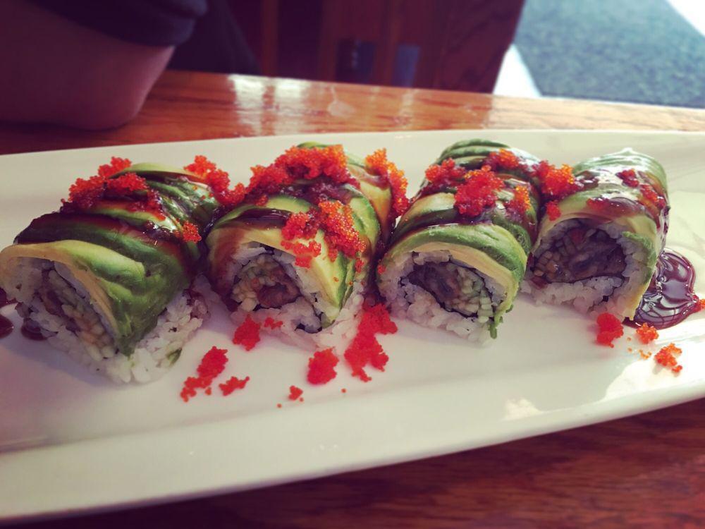 R40. Dragon Roll · Eel cucumber with avocado and tobiko outside.