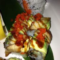R60. Rock 'n' Roll · Salmon skin and cucumber inside, eel, avocado and tobiko on top.