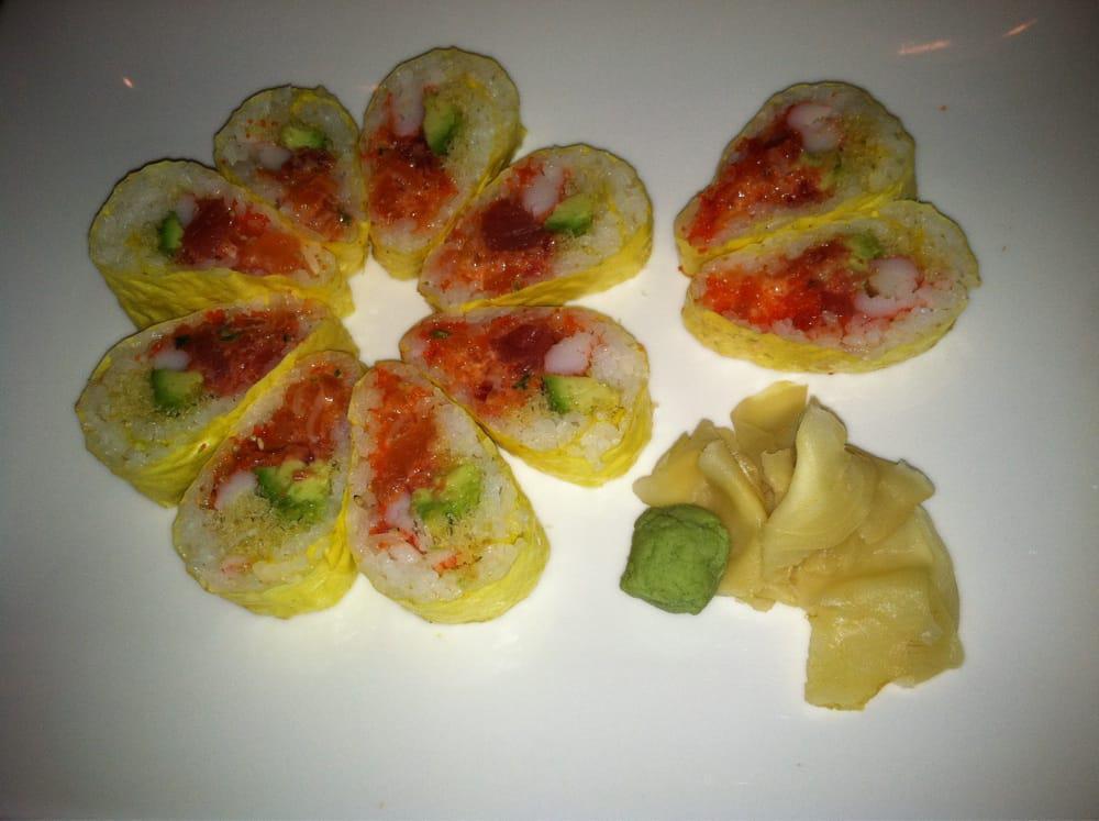 R66. Spicy Girl Roll · 10 pieces. Spicy salmon, tuna, yellowtail, avocado, tobiko, kani, crunch inside with seaweed outside. Spicy.