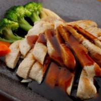 48. Chicken Teriyaki · Served with rice and miso soup or green salad, marinated in a delicate teriyaki sauce.