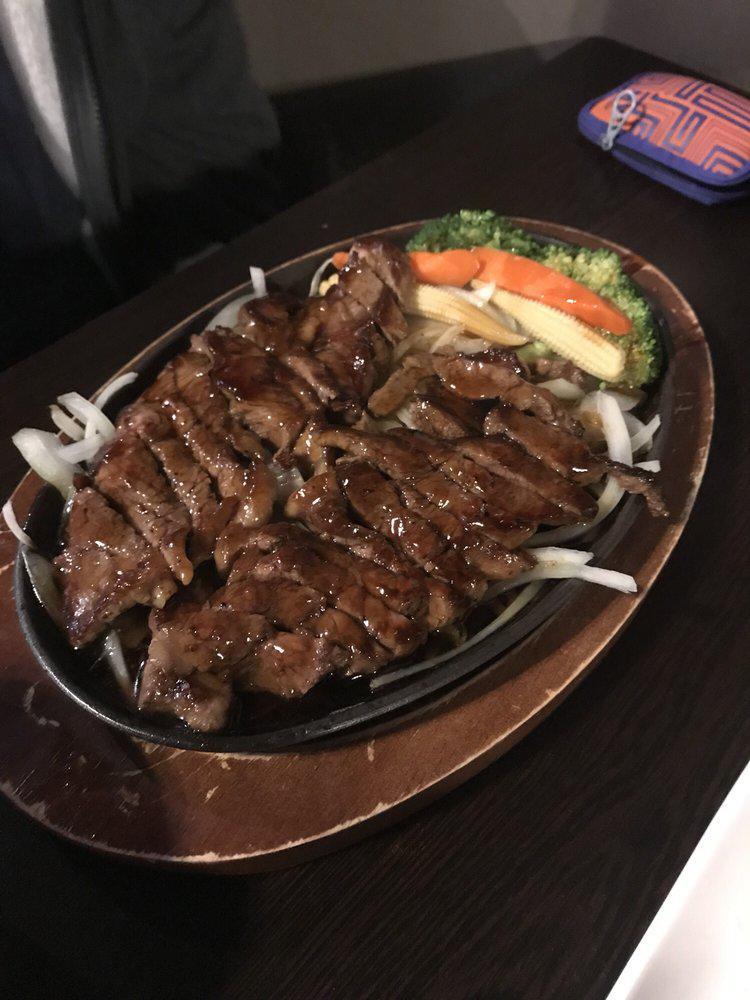 50. Beef Teriyaki · Served with rice and miso soup or green salad, marinated in a delicate teriyaki sauce.