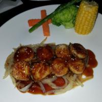 52. Scallop Teriyaki · Served with rice and miso soup or green salad, marinated in a delicate teriyaki sauce.