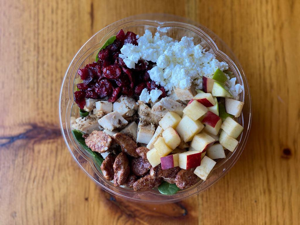 Warm Winter Salad Bowl · Organic mesclun mix, organic quinoa, warm roasted chicken, sun-dried cranberries, candied pecans, local apples, goat cheese with a side of Creamy Balsamic vinaigrette 