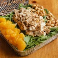 Asian Spinach Salad · Mandarin oranges and cashews over baby spinach with black and white sesame seeds.