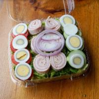 Chef Salad · Rolled turkey, ham and Swiss served over mixed greens with hard-boiled eggs, cucumbers, toma...