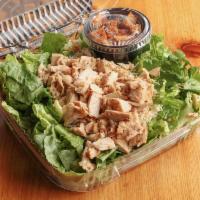 Grilled Chicken Caesar Salad · Diced grilled breast of chicken served over crisp romaine lettuce with croutons and grated P...