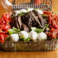 Grilled Portobello Salad · Sliced grilled portobello mushrooms served over mesclun greens, mozzarella, roasted red pepp...