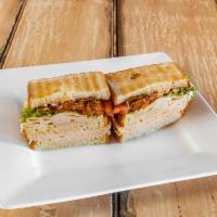 New York Sandwich · Crisp bacon, lettuce, tomato, turkey breast and mayonnaise on 3 slices of white toast.