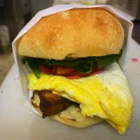 Breakfast Torta · Toasted bread, slow braised pork belly, chipotle aioli, tomato, baby spinach, pickled onions...