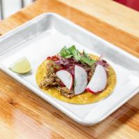 Char Taco (single) · Yellow corn tortillas, radish, criolla onions with choice of protein, red and green sauce.