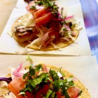 Fish Taco (single) · Yellow corn tortilla, grilled fish, cabbage, tomatoes, cabbage, pickled onions, cilanto, whi...