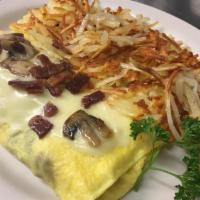 7. Mushroom and Swiss Omelette · Served with homefries and toast.