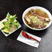 Beef Back Rib Pho (Lage Size Only) - Phở Sườn Bò · Our home-made pho with whole rack of ribs