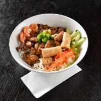 Vermicelli Salad Bowl · Vermicelli noodles served in a bowl with shredded iceberg lettuce, pickled shredded carrots,...