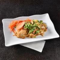 Pad See Ew · Stir fried wide rice noodles with egg, carrot and broccoli in a hot pan with our house speci...