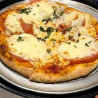 Margherita Pizza · Plum tomatoes, fresh mozzarella and basil.