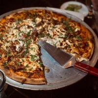 Birria Pizza 10' · shredded beef marinated in our secret sauce, Mexican cheese, mozzarella cheese, onions and c...