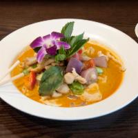 Thai Coconut Curry Sauce · Served with choice of side and rice. Hot and spicy.