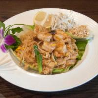Pad Thai · Stir fried rice sticks with bean sprout in spicy chili sauce, sprinkle with grounded peanut....
