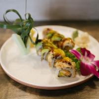 S11. Fox Lady Roll · Spicy crunch shrimp and mango inside, topped with tempura eel, avocado, mango sauce and eel ...