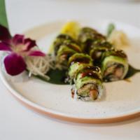 S12. Green Dragon Roll · Eel, crab meat and cucumber inside, topped with avocado and eel sauce.