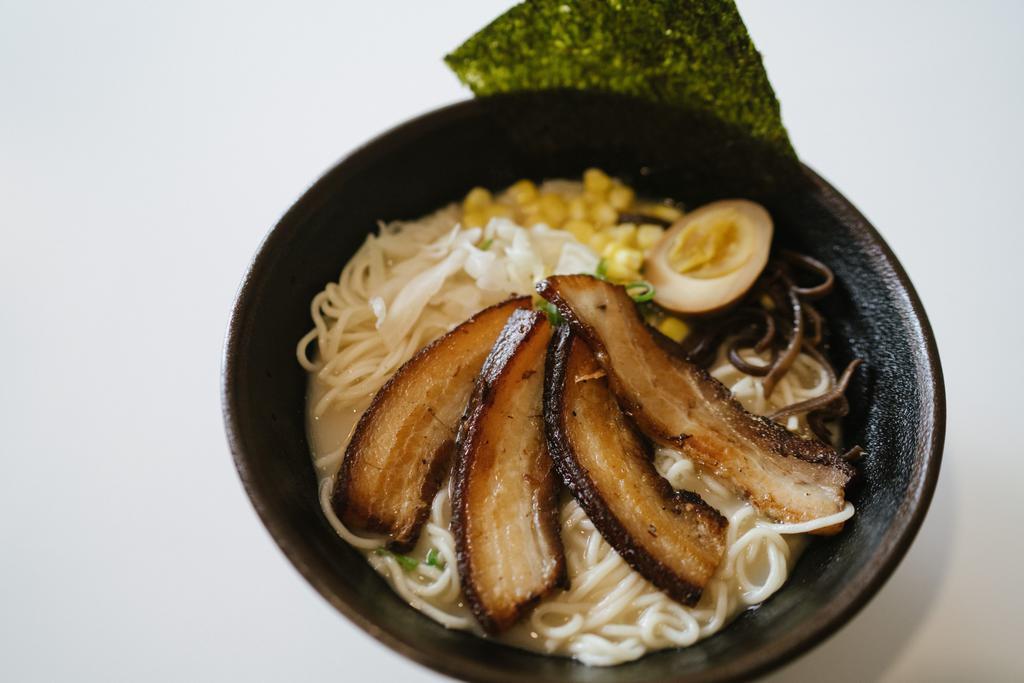 R2. Moshi Kakuni Ramen · Braised pork belly, cabbage, corn, soy marinated egg, kikurage mushroom, seaweed, scallion, creamy chicken broth.
