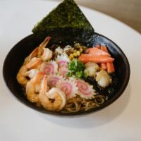 R6. Seafood Shoyu Ramen · Soy sauce and vegetable-based noodle soup noodle, served with shrimp, kani, scallops and fis...