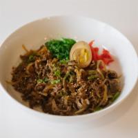 D5. Gyudon · Marinated and thinly sliced beef brisket cooked with onions, picked ginger, seaweed salad, s...