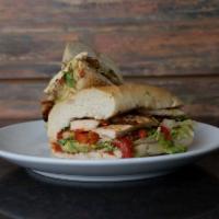 Grilled Chicken Sandwich · Comes with guacamole, lettuce, roasted red peppers, and tomato pesto. Served with choice of ...
