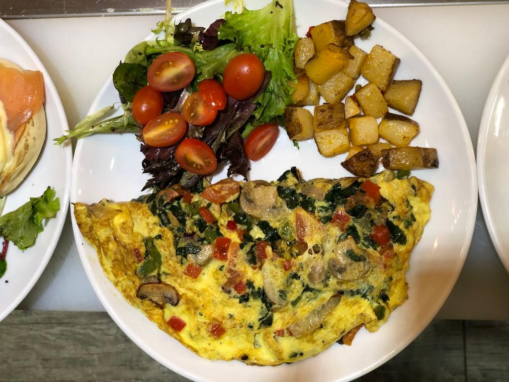 Vegetable Omelet · Comes with onions, peppers, tomatoes, and mushrooms. Served with house salad and fries.