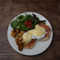 Eggs Benedict with Smoked Salmon · 2 poached eggs, smoked salmon and hollandaise sauce. Served on an English muffin with home f...