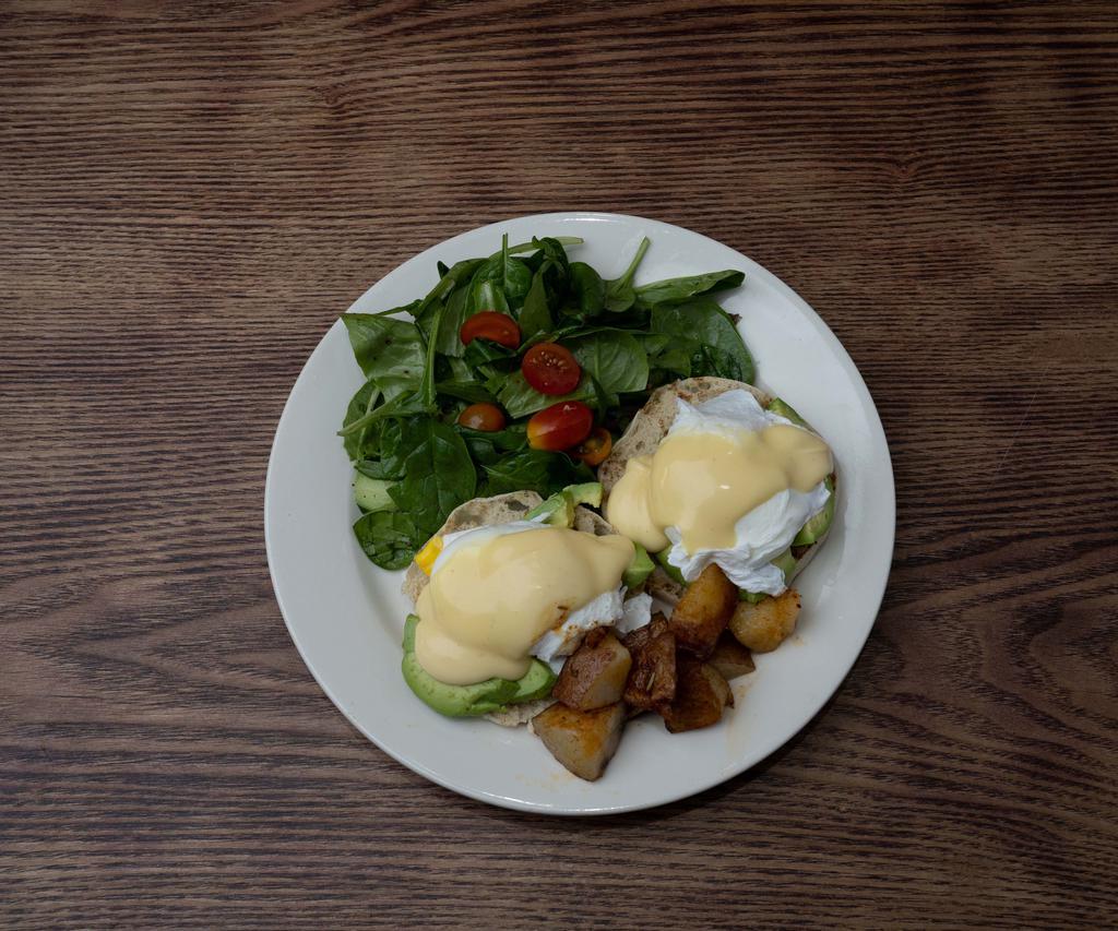 Eggs Benedict with Avocado · 2 poached eggs, avocado, and hollandaise sauce. Served on an English muffin with home fries and gossip salad.